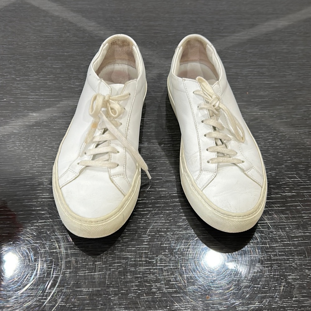 Woman’s Common Projects white sneakers